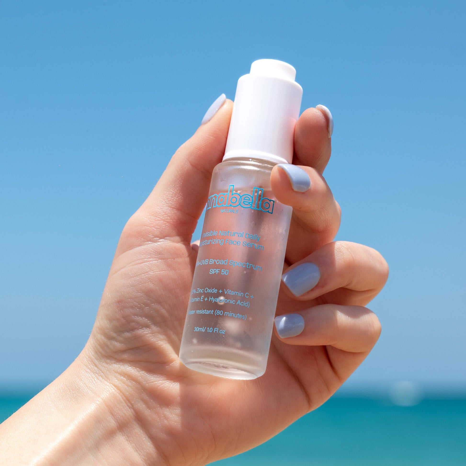 Natural daily invisible mineral hydrating moisturizing sunblock suncreen serum with zinc oxide and organic ingredients. Paraben-free fragrance-free vegan and non-comedogenic UVA+UVB broad spectrum SPF 50 waterproof reef safe light-weight with no white cast for sensitive and dry skin.